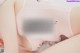 A close up of a person wearing a pink underwear.